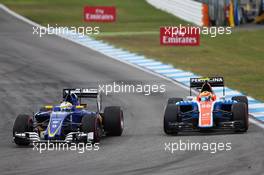 (L to R): Marcus Ericsson (SWE) Sauber C35 and Rio Haryanto (IDN) Manor Racing MRT05 battle for position. 31.07.2016. Formula 1 World Championship, Rd 12, German Grand Prix, Hockenheim, Germany, Race Day.