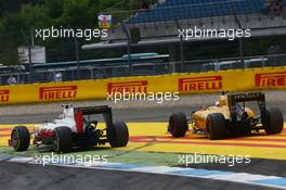 Romain Grosjean (FRA) Haas F1 Team VF-16 and Kevin Magnussen (DEN) Renault Sport F1 Team RS16 battle for position. 31.07.2016. Formula 1 World Championship, Rd 12, German Grand Prix, Hockenheim, Germany, Race Day.