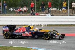 Carlos Sainz Jr (ESP) Scuderia Toro Rosso STR11 and Kevin Magnussen (DEN) Renault Sport F1 Team RS16 battle for position. 31.07.2016. Formula 1 World Championship, Rd 12, German Grand Prix, Hockenheim, Germany, Race Day.