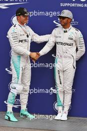 (L to R): Pole sitter Nico Rosberg (GER) Mercedes AMG F1 in parc ferme with team mate Lewis Hamilton (GBR) Mercedes AMG F1. 30.07.2016. Formula 1 World Championship, Rd 12, German Grand Prix, Hockenheim, Germany, Qualifying Day.