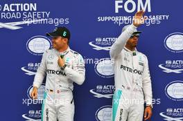 (L to R): Nico Rosberg (GER) Mercedes AMG F1 celebrates his pole position in parc ferme with second placed team mate Lewis Hamilton (GBR) Mercedes AMG F1. 30.07.2016. Formula 1 World Championship, Rd 12, German Grand Prix, Hockenheim, Germany, Qualifying Day.