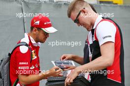 Sebastian Vettel (GER) Ferrari signs autographs for the fans. 28.07.2016. Formula 1 World Championship, Rd 12, German Grand Prix, Hockenheim, Germany, Preparation Day.