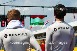 (L to R): Kevin Magnussen (DEN) Renault Sport F1 Team and Jolyon Palmer (GBR) Renault Sport F1 Team as the grid observes the national anthem. 24.07.2016. Formula 1 World Championship, Rd 11, Hungarian Grand Prix, Budapest, Hungary, Race Day.