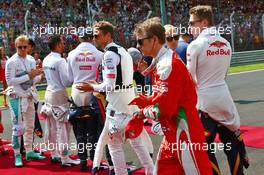 Kimi Raikkonen (FIN) Ferrari as the grid observes the national anthem. 24.07.2016. Formula 1 World Championship, Rd 11, Hungarian Grand Prix, Budapest, Hungary, Race Day.