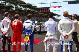 The grid observes the national anthem. 24.07.2016. Formula 1 World Championship, Rd 11, Hungarian Grand Prix, Budapest, Hungary, Race Day.