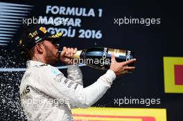 Race winner Lewis Hamilton (GBR) Mercedes AMG F1 celebrates on the podium. 24.07.2016. Formula 1 World Championship, Rd 11, Hungarian Grand Prix, Budapest, Hungary, Race Day.