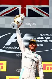 Race winner Lewis Hamilton (GBR) Mercedes AMG F1 celebrates on the podium. 24.07.2016. Formula 1 World Championship, Rd 11, Hungarian Grand Prix, Budapest, Hungary, Race Day.