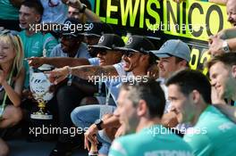 Race winner Lewis Hamilton (GBR) Mercedes AMG F1 celebrates with team mate Nico Rosberg (GER) Mercedes AMG F1 and the team. 24.07.2016. Formula 1 World Championship, Rd 11, Hungarian Grand Prix, Budapest, Hungary, Race Day.