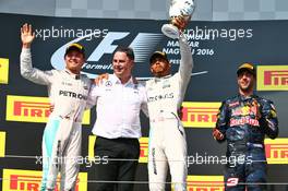 The podium (L to R): Nico Rosberg (GER) Mercedes AMG F1, second; Ron Meadows (GBR) Mercedes GP Team Manager; Lewis Hamilton (GBR) Mercedes AMG F1, race winner; Daniel Ricciardo (AUS) Red Bull Racing, third. 24.07.2016. Formula 1 World Championship, Rd 11, Hungarian Grand Prix, Budapest, Hungary, Race Day.