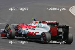 Esteban Gutierrez (MEX) Haas F1 Team VF-16 and Kimi Raikkonen (FIN) Ferrari SF16-H. 24.07.2016. Formula 1 World Championship, Rd 11, Hungarian Grand Prix, Budapest, Hungary, Race Day.
