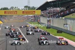 (L to R): Lewis Hamilton (GBR) Mercedes AMG F1; Nico Rosberg (GER) Mercedes AMG F1; and Daniel Ricciardo (AUS) Red Bull Racing battle for the lead at the start of the race. 24.07.2016. Formula 1 World Championship, Rd 11, Hungarian Grand Prix, Budapest, Hungary, Race Day.