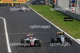 Esteban Gutierrez (MEX) Haas F1 Team VF-16 and Sergio Perez (MEX) Sahara Force India F1 VJM09. 24.07.2016. Formula 1 World Championship, Rd 11, Hungarian Grand Prix, Budapest, Hungary, Race Day.
