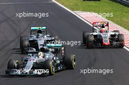 Lewis Hamilton (GBR) Mercedes AMG F1 W07 Hybrid leads team mate Nico Rosberg (GER) Mercedes AMG F1 W07 Hybrid. 24.07.2016. Formula 1 World Championship, Rd 11, Hungarian Grand Prix, Budapest, Hungary, Race Day.