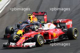 Kimi Raikkonen (FIN) Ferrari SF16-H and Max Verstappen (NLD) Red Bull Racing RB12 battle for position. 24.07.2016. Formula 1 World Championship, Rd 11, Hungarian Grand Prix, Budapest, Hungary, Race Day.