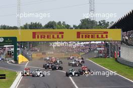 (L to R): Max Verstappen (NLD) Red Bull Racing RB12; Lewis Hamilton (GBR) Mercedes AMG F1; Nico Rosberg (GER) Mercedes AMG F1; and Daniel Ricciardo (AUS) Red Bull Racing battle for the lead at the start of the race. 24.07.2016. Formula 1 World Championship, Rd 11, Hungarian Grand Prix, Budapest, Hungary, Race Day.