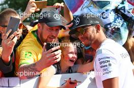 Lewis Hamilton (GBR) Mercedes AMG F1 with fans. 23.07.2016. Formula 1 World Championship, Rd 11, Hungarian Grand Prix, Budapest, Hungary, Qualifying Day.