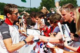 Romain Grosjean (FRA) Haas F1 Team signs autographs for the fans. 23.07.2016. Formula 1 World Championship, Rd 11, Hungarian Grand Prix, Budapest, Hungary, Qualifying Day.