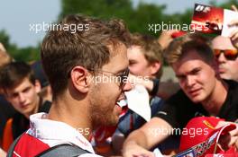 Sebastian Vettel (GER) Ferrari signs autographs for the fans. 23.07.2016. Formula 1 World Championship, Rd 11, Hungarian Grand Prix, Budapest, Hungary, Qualifying Day.