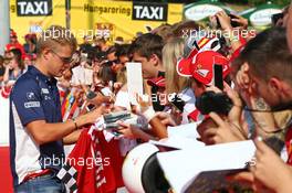 Marcus Ericsson (SWE) Sauber F1 Team signs autographs for the fans. 23.07.2016. Formula 1 World Championship, Rd 11, Hungarian Grand Prix, Budapest, Hungary, Qualifying Day.