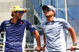 (L to R): Felipe Nasr (BRA) Sauber F1 Team with Rio Haryanto (IDN) Manor Racing on the drivers parade. 24.07.2016. Formula 1 World Championship, Rd 11, Hungarian Grand Prix, Budapest, Hungary, Race Day.