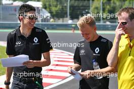 (L to R): Esteban Ocon (FRA) Renault Sport F1 Team Test Driver and Kevin Magnussen (DEN) Renault Sport F1 Team walk the circuit. 21.07.2016. Formula 1 World Championship, Rd 11, Hungarian Grand Prix, Budapest, Hungary, Preparation Day.