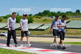 Rio Haryanto (IDN) Manor Racing walks the circuit with the team. 21.07.2016. Formula 1 World Championship, Rd 11, Hungarian Grand Prix, Budapest, Hungary, Preparation Day.
