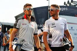(L to R): Romain Grosjean (FRA) Haas F1 Team with Jenson Button (GBR) McLaren. 02.09.2016. Formula 1 World Championship, Rd 14, Italian Grand Prix, Monza, Italy, Practice Day.
