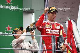 1st place Nico Rosberg (GER) Mercedes AMG Petronas F1 W07 and 3rd place Sebastian Vettel (GER) Scuderia Ferrari SF16-H. 04.09.2016. Formula 1 World Championship, Rd 14, Italian Grand Prix, Monza, Italy, Race Day.