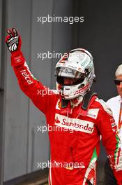 Sebastian Vettel (GER) Ferrari celebrates his third position in parc ferme. 04.09.2016. Formula 1 World Championship, Rd 14, Italian Grand Prix, Monza, Italy, Race Day.