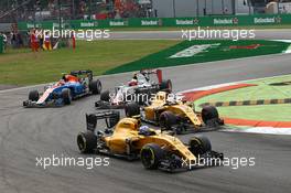 Jolyon Palmer (GBR) Renault Sport F1 Team RS16 and Kevin Magnussen (DEN) Renault Sport F1 Team RS16. 04.09.2016. Formula 1 World Championship, Rd 14, Italian Grand Prix, Monza, Italy, Race Day.