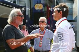(L to R): Flavio Briatore (ITA) with Piero Ferrari (ITA) Ferrari Vice-President and Toto Wolff (GER) Mercedes AMG F1 Shareholder and Executive Director. 03.09.2016. Formula 1 World Championship, Rd 14, Italian Grand Prix, Monza, Italy, Qualifying Day.