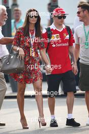 Kimi Raikkonen (FIN) Ferrari with his wife Minttu Raikkonen (FIN). 03.09.2016. Formula 1 World Championship, Rd 14, Italian Grand Prix, Monza, Italy, Qualifying Day.