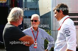 (L to R): Flavio Briatore (ITA) with Piero Ferrari (ITA) Ferrari Vice-President and Toto Wolff (GER) Mercedes AMG F1 Shareholder and Executive Director. 03.09.2016. Formula 1 World Championship, Rd 14, Italian Grand Prix, Monza, Italy, Qualifying Day.