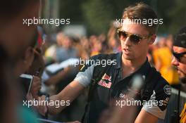 Daniil Kvyat (RUS) Scuderia Toro Rosso signs autographs for the fans. 03.09.2016. Formula 1 World Championship, Rd 14, Italian Grand Prix, Monza, Italy, Qualifying Day.