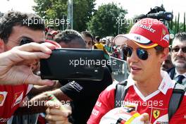 Sebastian Vettel (GER) Ferrari with fans. 01.09.2016. Formula 1 World Championship, Rd 14, Italian Grand Prix, Monza, Italy, Preparation Day.