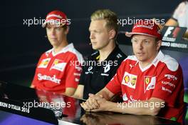 The FIA Press Conference (L to R): Sebastian Vettel (GER) Ferrari with Kevin Magnussen (DEN) Renault Sport F1 Team and Kimi Raikkonen (FIN) Ferrari. 01.09.2016. Formula 1 World Championship, Rd 14, Italian Grand Prix, Monza, Italy, Preparation Day.