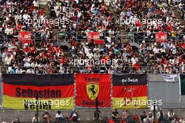 Fans in the grandstand and banners for Sebastian Vettel (GER) Ferrari. 07.10.2016. Formula 1 World Championship, Rd 17, Japanese Grand Prix, Suzuka, Japan, Practice Day.