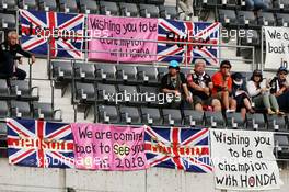 Fans in the grandstand and banners for Jenson Button (GBR) McLaren. 07.10.2016. Formula 1 World Championship, Rd 17, Japanese Grand Prix, Suzuka, Japan, Practice Day.