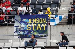 Fans in the grandstand and a banner for Jenson Button (GBR) McLaren. 07.10.2016. Formula 1 World Championship, Rd 17, Japanese Grand Prix, Suzuka, Japan, Practice Day.