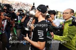 Race winner Nico Rosberg (GER) Mercedes AMG F1 celebrates the Constructors' title with the team. 09.10.2016. Formula 1 World Championship, Rd 17, Japanese Grand Prix, Suzuka, Japan, Race Day.