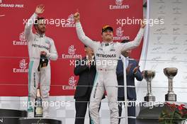 Race winner Nico Rosberg (GER) Mercedes AMG F1 (Right) celebrates on the podium with third placed team mate Lewis Hamilton (GBR) Mercedes AMG F1. 09.10.2016. Formula 1 World Championship, Rd 17, Japanese Grand Prix, Suzuka, Japan, Race Day.
