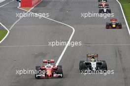 Sebastian Vettel (GER) Ferrari SF16-H and Sergio Perez (MEX) Sahara Force India F1 VJM09 battle for position. 09.10.2016. Formula 1 World Championship, Rd 17, Japanese Grand Prix, Suzuka, Japan, Race Day.