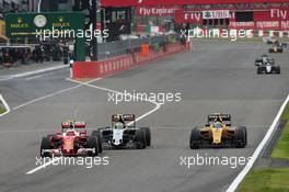 Kimi Raikkonen (FIN) Ferrari SF16-H battle for position with Sergio Perez (MEX) Sahara Force India F1 VJM09 and Jolyon Palmer (GBR) Renault Sport F1 Team RS16. 09.10.2016. Formula 1 World Championship, Rd 17, Japanese Grand Prix, Suzuka, Japan, Race Day.