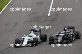 Felipe Massa (BRA) Williams FW38 and Fernando Alonso (ESP) McLaren MP4-31 battle for position. 09.10.2016. Formula 1 World Championship, Rd 17, Japanese Grand Prix, Suzuka, Japan, Race Day.