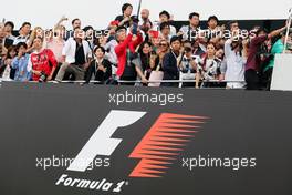 Podium watched by fans. 09.10.2016. Formula 1 World Championship, Rd 17, Japanese Grand Prix, Suzuka, Japan, Race Day.