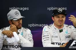 (L to R): Lewis Hamilton (GBR) Mercedes AMG F1 and team mate Nico Rosberg (GER) Mercedes AMG F1 in the post qualifying FIA Press Conference. 08.10.2016. Formula 1 World Championship, Rd 17, Japanese Grand Prix, Suzuka, Japan, Qualifying Day.