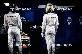 (L to R): Nico Rosberg (GER) Mercedes AMG F1 and team mate Lewis Hamilton (GBR) Mercedes AMG F1 in parc ferme. 08.10.2016. Formula 1 World Championship, Rd 17, Japanese Grand Prix, Suzuka, Japan, Qualifying Day.