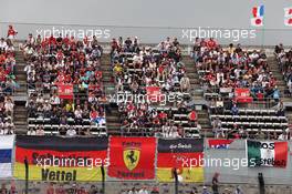 Fans in the grandstand. 08.10.2016. Formula 1 World Championship, Rd 17, Japanese Grand Prix, Suzuka, Japan, Qualifying Day.