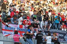 Lewis Hamilton (GBR) Mercedes AMG F1 signs autographs for the fans in the grandstand. 06.10.2016. Formula 1 World Championship, Rd 17, Japanese Grand Prix, Suzuka, Japan, Preparation Day.