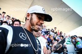 Lewis Hamilton (GBR) Mercedes AMG F1 signs autographs for the fans in the grandstand. 06.10.2016. Formula 1 World Championship, Rd 17, Japanese Grand Prix, Suzuka, Japan, Preparation Day.